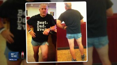 A man proudly wearing tiny denim shorts showing front and back views.